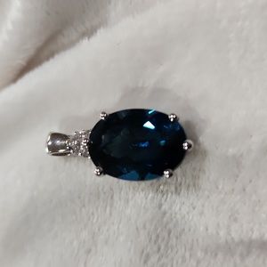 Saphire color pendant with-Swarovski crystal encased in a sterling siver setting